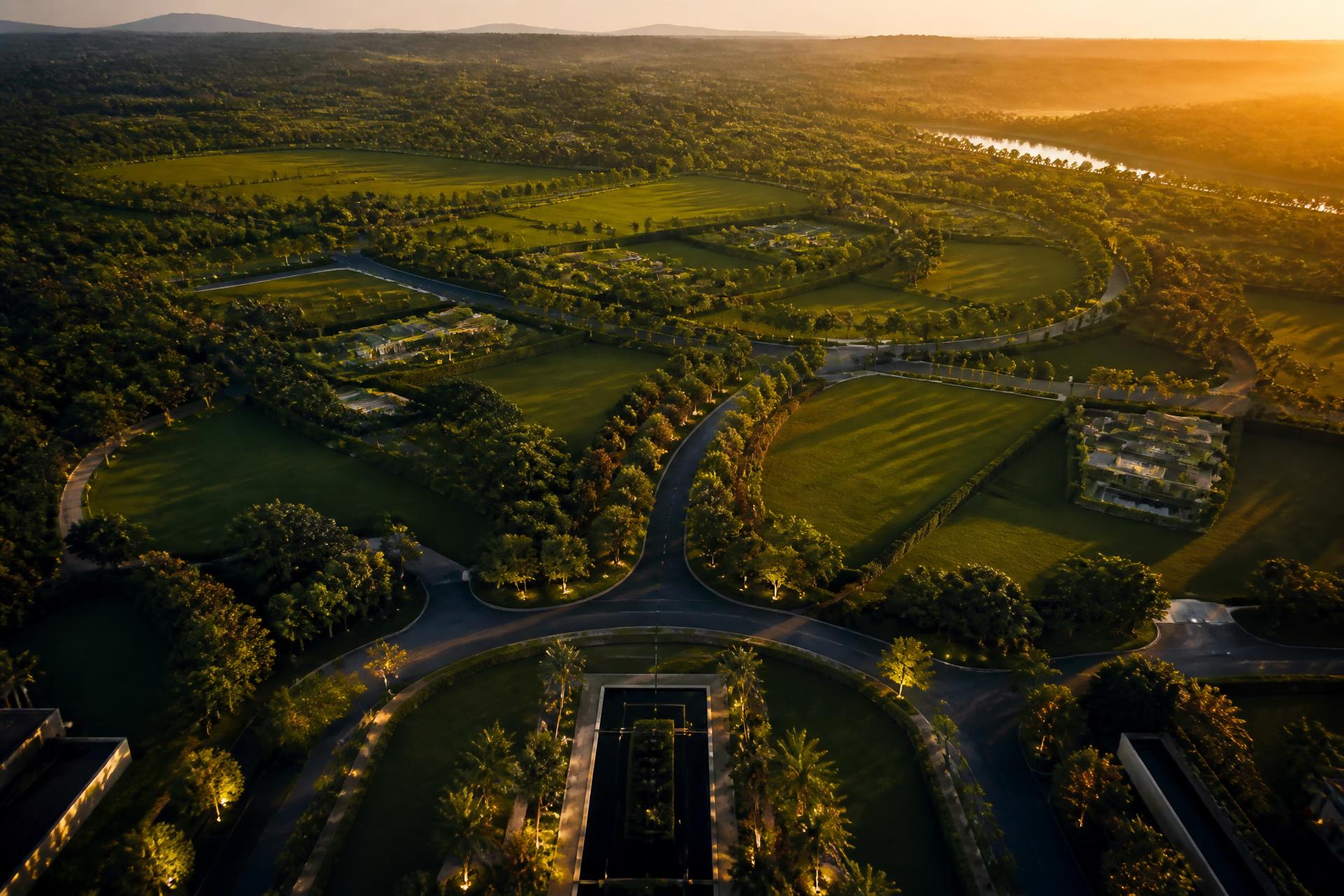 Aerial view of Monarch Group's luxury plotted development at golden hour